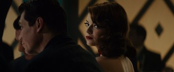 Movie still from “Gangster Squad” (2013), directed by Ruben Fleischer – A person wearing a dress; Close Up shot, Over the shoulder angle