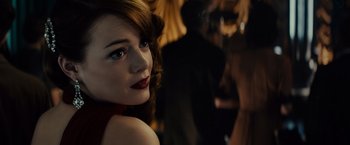 Movie still from “Gangster Squad” (2013), directed by Ruben Fleischer – A person wearing a red dress; Close Up shot, Over the shoulder angle