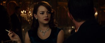 Movie still from “Gangster Squad” (2013), directed by Ruben Fleischer – A woman in a blue dress and a man in a black suit; Close Up shot, Over the shoulder angle