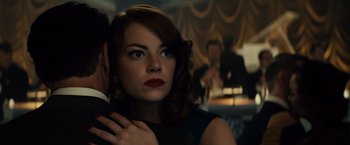 Movie still from “Gangster Squad” (2013), directed by Ruben Fleischer – A person wearing a suit and tie; Close Up shot, Over the shoulder angle