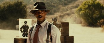 Movie still from “Gangster Squad” (2013), directed by Ruben Fleischer – A man wearing a hat and suspenders and a tie; Close Up shot, Low angle