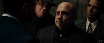 Movie still from “Gangster Squad” (2013), directed by Ruben Fleischer – A man in a suit and a man in a hat; Close Up shot, Over the shoulder angle