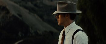 Movie still from “Gangster Squad” (2013), directed by Ruben Fleischer – A man wearing a hat and a tie; Close Up shot, Low angle