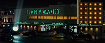 Movie still from “Gangster Squad” (2013), directed by Ruben Fleischer – A building that is lit up at night; Extreme Wide shot, Low angle