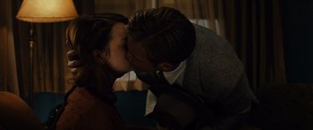 Movie still from “Gangster Squad” (2013), directed by Ruben Fleischer – A man and a woman kissing each other in the dark; Close Up shot, Over the shoulder angle