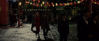 Movie still from “Gangster Squad” (2013), directed by Ruben Fleischer – A group of people walking down a street at night; Wide shot, High angle