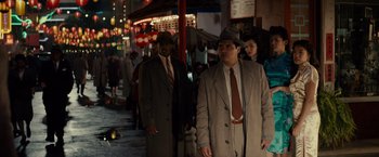 Movie still from “Gangster Squad” (2013), directed by Ruben Fleischer – A man in a suit and tie standing next to another man in a suit and tie; Wide shot, High angle
