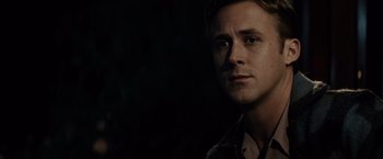 Movie still from “Gangster Squad” (2013), directed by Ruben Fleischer – A person wearing a shirt; Close Up shot, Over the shoulder angle