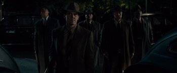 Movie still from “Gangster Squad” (2013), directed by Ruben Fleischer – A group of men in suits and hats are walking; Medium shot, Low angle