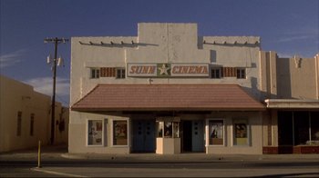 Movie still from “Gas Food Lodging” (1992), directed by Allison Anders – A movie theater that has been converted into a movie theater; Extreme Wide shot, Low angle