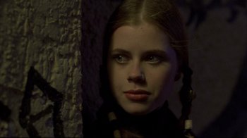 Movie still from “Gas Food Lodging” (1992), directed by Allison Anders – A young woman is looking into the camera; Close Up shot, Over the shoulder angle