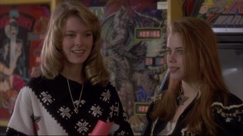 Movie still from “Gas Food Lodging” (1992), directed by Allison Anders – Two young women standing next to each other in a room; Close Up shot, Over the shoulder angle