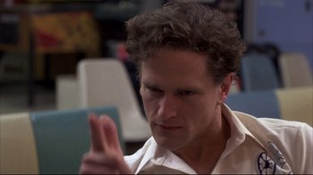 Movie still from “Gas Food Lodging” (1992), directed by Allison Anders – A person holding a cell phone; Close Up shot, Over the shoulder angle