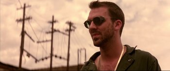 Movie still from “George Washington” (2000), directed by David Gordon Green – A person wearing sunglasses; Close Up shot, Low angle