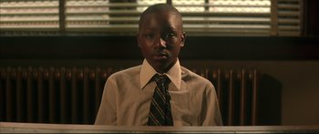 Movie still from “George Washington” (2000), directed by David Gordon Green – A young man in a dress shirt and a tie; Close Up shot, Low angle