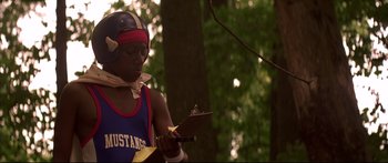 Movie still from “George Washington” (2000), directed by David Gordon Green – A man wearing a helmet holding a clipboard; Medium shot, Low angle