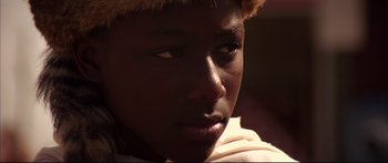 Movie still from “George Washington” (2000), directed by David Gordon Green – A person wearing a hat; Close Up shot, Low angle