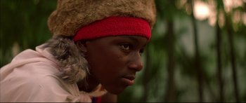 Movie still from “George Washington” (2000), directed by David Gordon Green – A person wearing a red hat and a fur hat; Close Up shot, Low angle