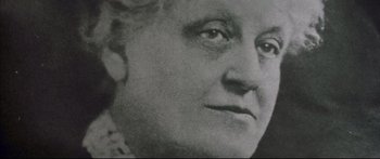 Movie still from “George Washington” (2000), directed by David Gordon Green – An old black and white photo of a woman's face; Close Up shot, Low angle