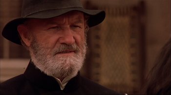 Movie still from “Geronimo: An American Legend” (1993), directed by Walter Hill – An old man with a beard wearing a black hat; Close Up shot, Low angle