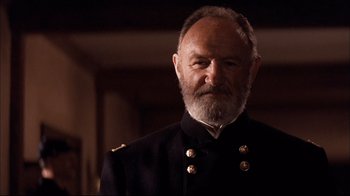 Movie still from “Geronimo: An American Legend” (1993), directed by Walter Hill – An old man with a beard wearing a military uniform; Close Up shot, Low angle