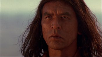 Movie still from “Geronimo: An American Legend” (1993), directed by Walter Hill – A person with long brown hair; Close Up shot, Low angle