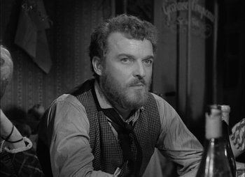 Movie still from “Gervaise” (1956), directed by René Clément – Black and white photograph of a man with a beard; Close Up shot, Low angle