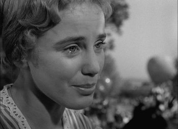 Movie still from “Gervaise” (1956), directed by René Clément – A woman's face in black - and - white photo; Close Up shot, Over the shoulder angle