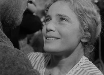 Movie still from “Gervaise” (1956), directed by René Clément – A young girl looking up into the sky; Close Up shot, High angle