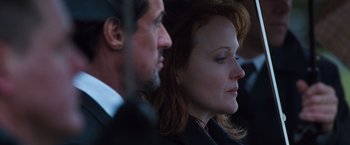 Movie still from “Get Carter” (2000), directed by Stephen Kay – A man and a woman are looking into the distance; Close Up shot, Over the shoulder angle