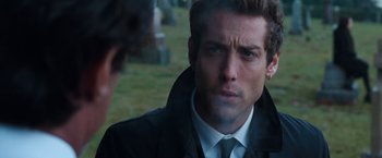 Movie still from “Get Carter” (2000), directed by Stephen Kay – A man in a suit and a tie; Close Up shot, Over the shoulder angle