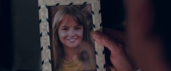 Movie still from “Get Carter” (2000), directed by Stephen Kay – A person holding a picture of a young girl; Extreme Close Up shot, Overhead angle