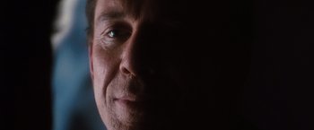 Movie still from “Get Carter” (2000), directed by Stephen Kay – A man's face in the dark; Extreme Close Up shot, Low angle