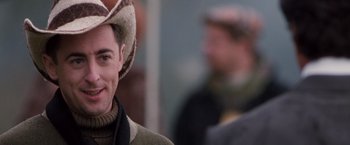 Movie still from “Get Carter” (2000), directed by Stephen Kay – A person wearing a cowboy hat; Close Up shot, Over the shoulder angle