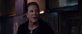 Movie still from “Get Carter” (2000), directed by Stephen Kay – A person wearing a necklace; Close Up shot, Low angle