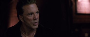 Movie still from “Get Carter” (2000), directed by Stephen Kay – A person wearing a black shirt; Close Up shot, Over the shoulder angle