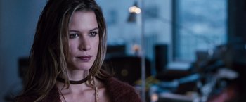 Movie still from “Get Carter” (2000), directed by Stephen Kay – A person wearing a necklace; Close Up shot, Over the shoulder angle