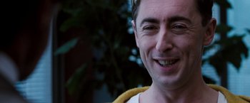 Movie still from “Get Carter” (2000), directed by Stephen Kay – A man smiling for the camera; Close Up shot, Low angle