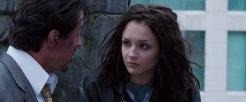 Movie still from “Get Carter” (2000), directed by Stephen Kay – A man and a woman looking at one another; Close Up shot, Over the shoulder angle