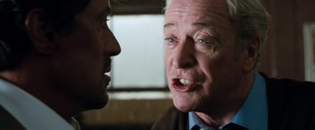 Movie still from “Get Carter” (2000), directed by Stephen Kay – A man and a man talking to each other; Close Up shot, Over the shoulder angle