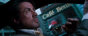 Movie still from “Get Carter” (2000), directed by Stephen Kay – A person wearing a suit and tie; Close Up shot, Over the shoulder angle