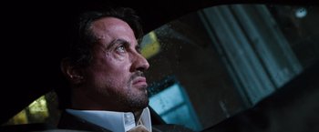 Movie still from “Get Carter” (2000), directed by Stephen Kay – A person in a car looking out the window; Close Up shot, Low angle