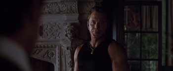 Movie still from “Get Carter” (2000), directed by Stephen Kay – A person wearing a black shirt; Close Up shot, Over the shoulder angle