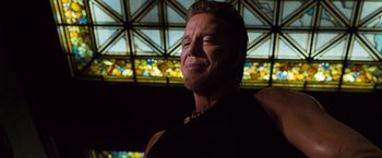 Movie still from “Get Carter” (2000), directed by Stephen Kay – A person in a room with stained glass; Close Up shot, Low angle