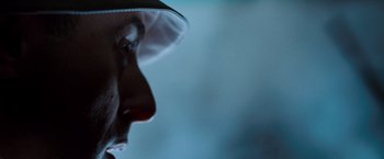 Movie still from “Get Carter” (2000), directed by Stephen Kay – A person's face with a hat on; Extreme Close Up shot, Low angle