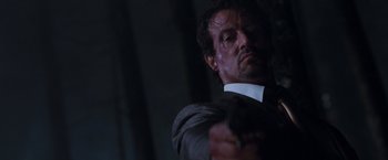 Movie still from “Get Carter” (2000), directed by Stephen Kay – A person holding a gun; Close Up shot, Low angle