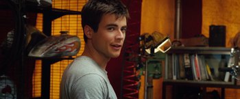 Movie still from “Ghost Rider” (2007), directed by Mark Steven Johnson – A young man is posing for a picture; Close Up shot, Over the shoulder angle