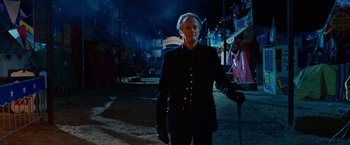 Movie still from “Ghost Rider” (2007), directed by Mark Steven Johnson – A man in a black jacket and a black hat; Medium shot, Low angle