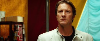 Movie still from “Ghost Rider” (2007), directed by Mark Steven Johnson – A person wearing a white jacket; Close Up shot, Low angle