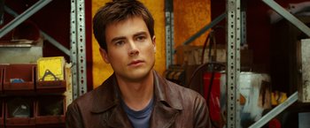 Movie still from “Ghost Rider” (2007), directed by Mark Steven Johnson – A person wearing a leather jacket; Close Up shot, Over the shoulder angle